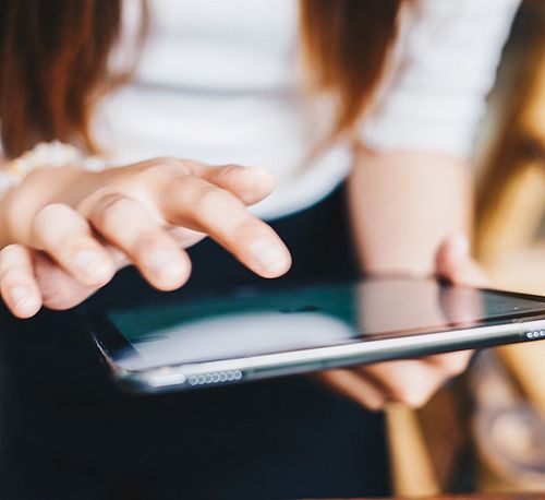 Woman signing e-Consent